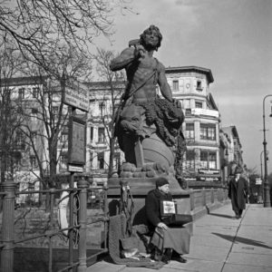 A totally blind man must beg on a bridge at Berlin, Germany 1930s. A totally blind man must beg on a bridge at Berlin, Germany 1930s.